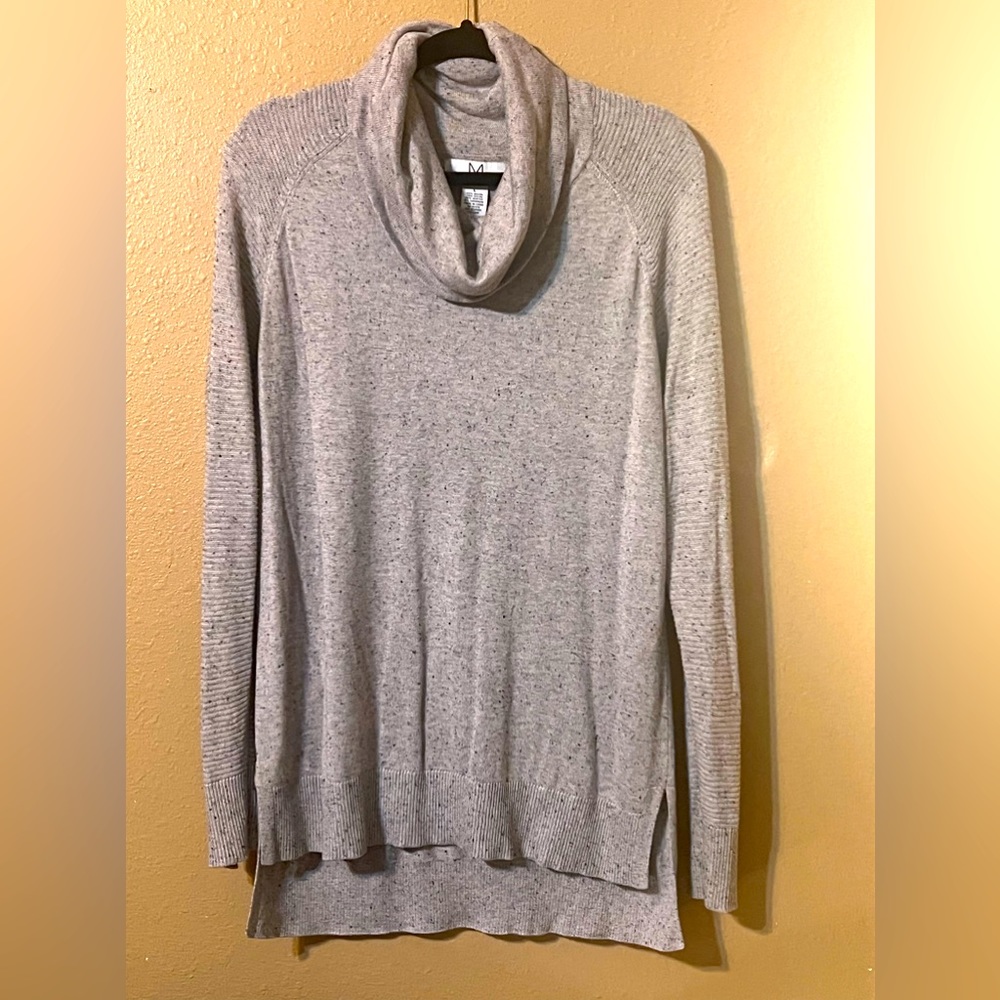 Cowl neck sweater with contrasting knit pattern on sleeves.